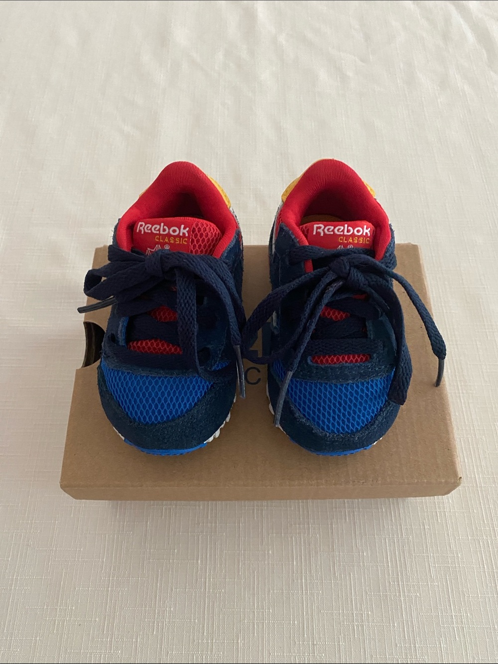 Reebok CL Leather Color Block Sneakers for babies.